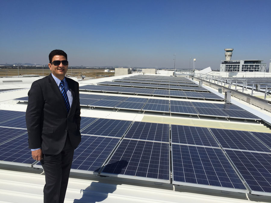 Krishan Tangri, General Manager of Assets pictured in front of new Brisbane Airport solar array